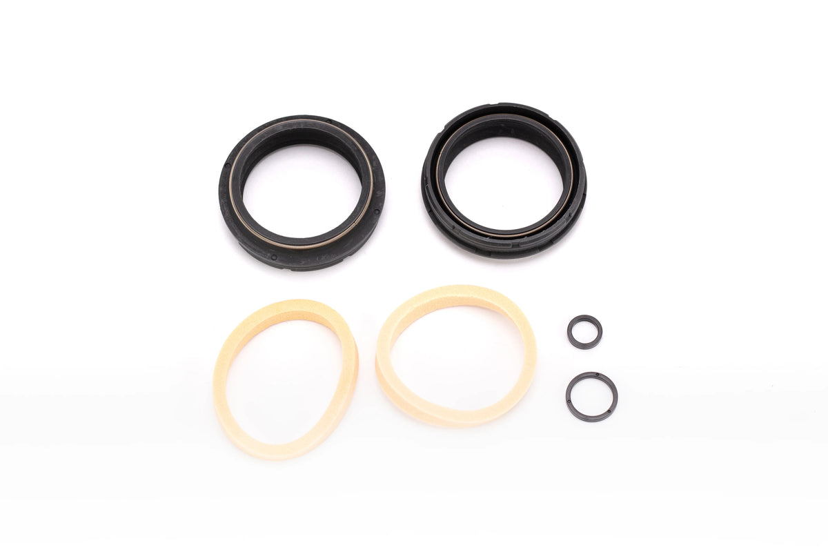 FOX 40mm low-friction flangeless dust wiper kit on white: two large black wiper seals, two tan foam rings, and small crush washers.