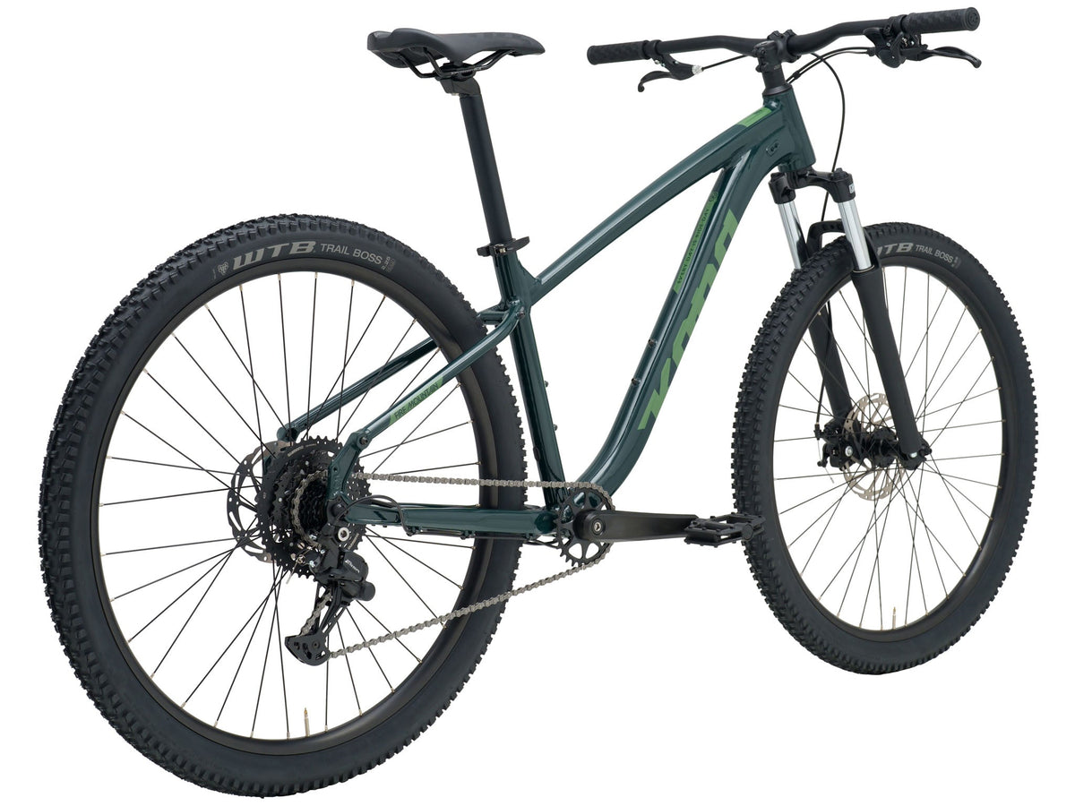 Kona Fire Mountain 2026 hardtail mountain bike in Gloss Emerald green, three-quarter rear view showing drivetrain