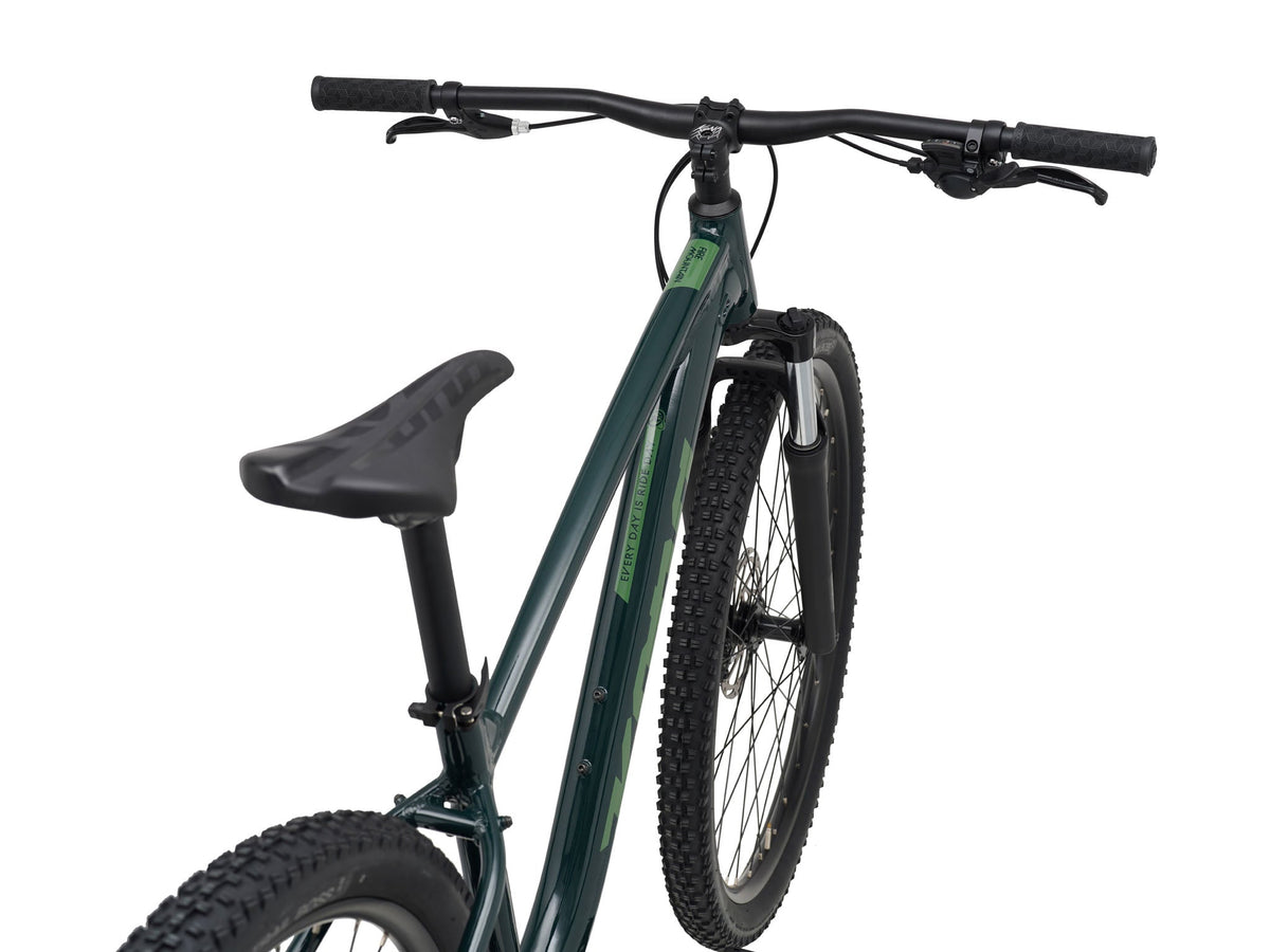 Kona Fire Mountain 2026 hardtail mountain bike in Gloss Emerald green, front three-quarter close-up view of cockpit and fork