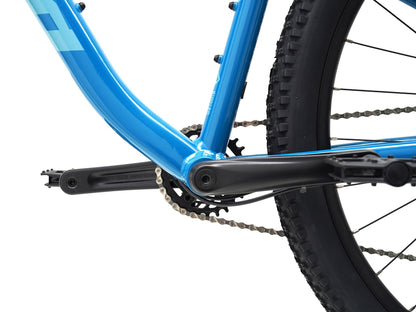 Kona Lava Dome 2026 hardtail mountain bike in Gloss Celestial Blue, close-up detail of crankset, chain, and rear wheel