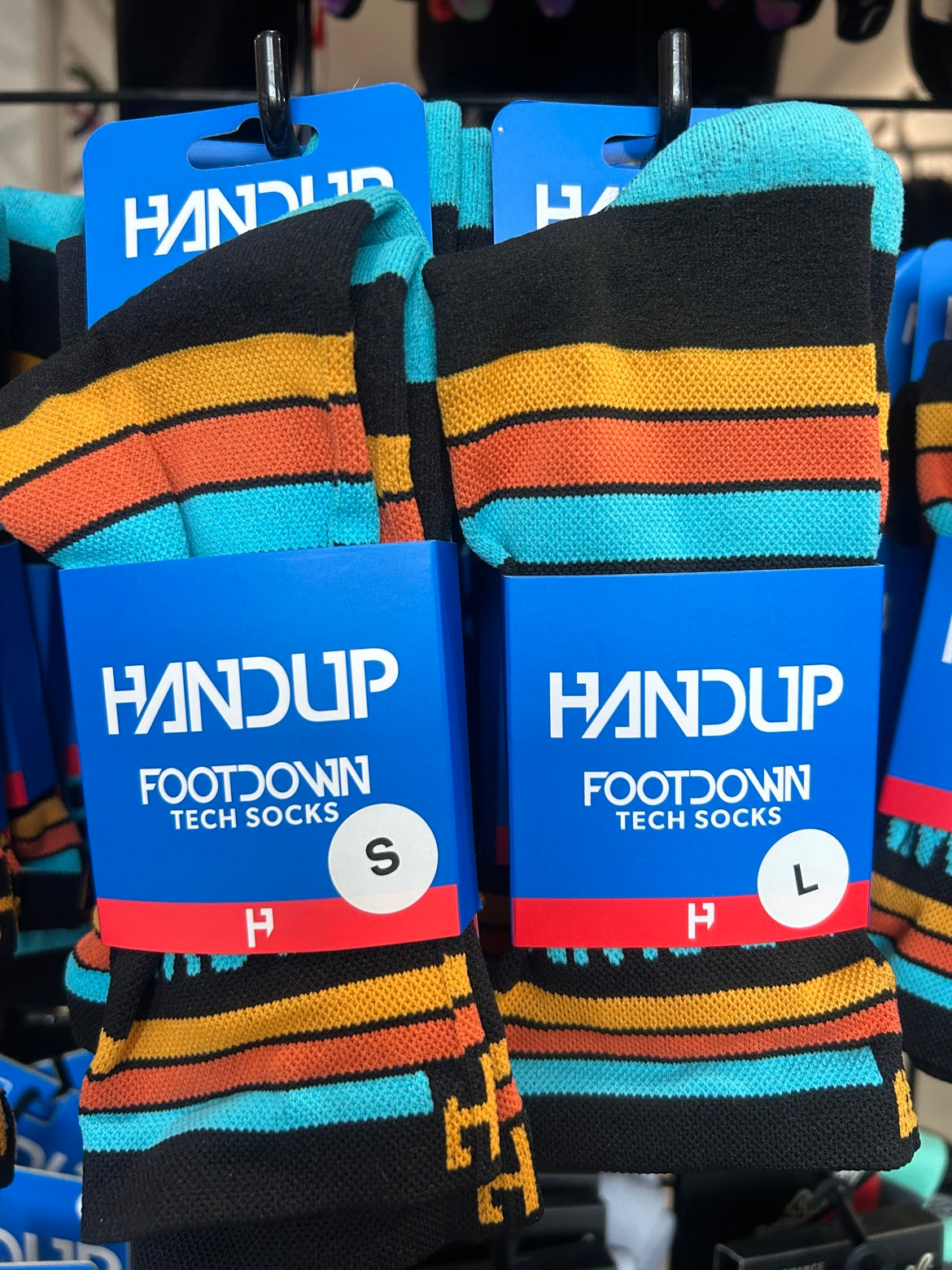 HandUp Brown County Bikes Retro Socks — retail packaging, HandUp FootDown Tech Socks, sizes S and L