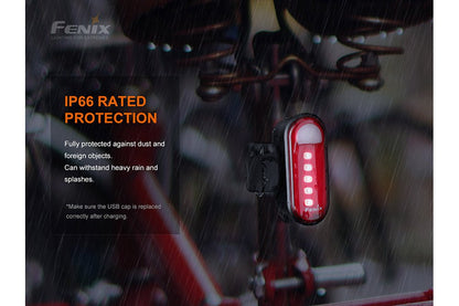 Fenix BC05R V2.0 IP66 rated protection: red taillight glowing in heavy rain, fully protected against dust and foreign objects, withstands heavy rain and splashes