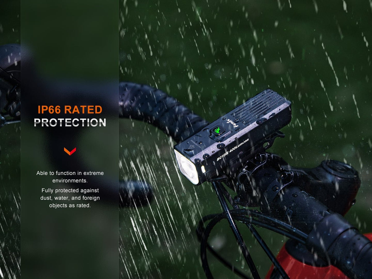 Fenix BC15R IP66 rated protection: light functioning in heavy rain on a bicycle handlebar, fully protected against dust, water, and foreign objects