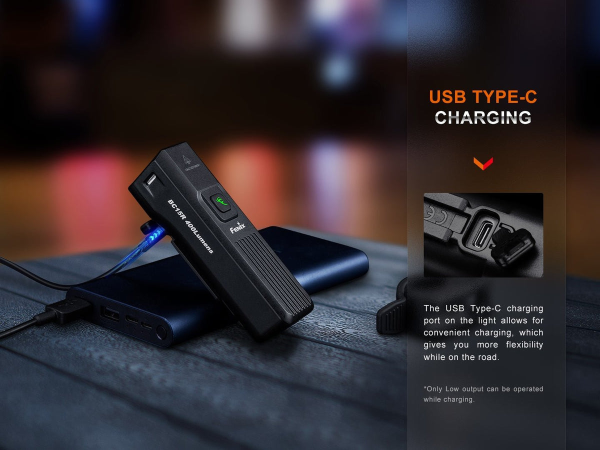 Fenix BC15R USB Type-C charging: light leaning on a power bank with charging cable; only Low output can be operated while charging