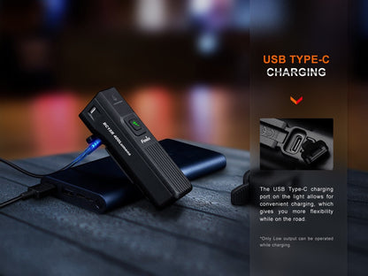 Fenix BC15R USB Type-C charging: light leaning on a power bank with charging cable; only Low output can be operated while charging
