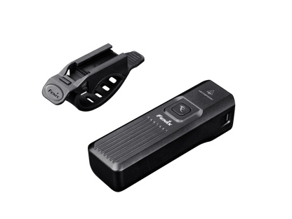 Fenix BC15R bike light top view showing power button, Fenix branding, and heat dissipation fins, with the silicone strap mount shown detached beside it