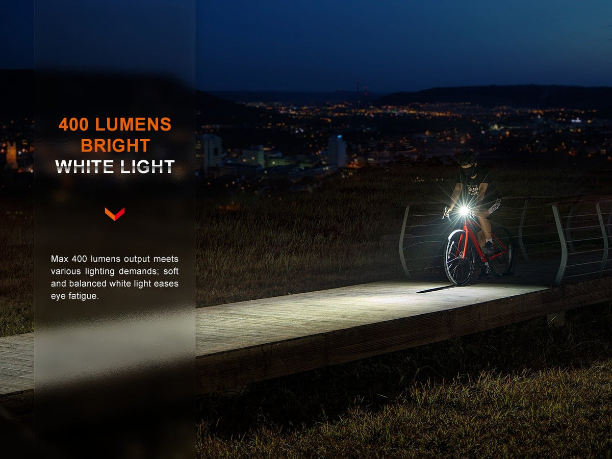 Fenix BC15R 400 lumens bright white light: cyclist riding on a boardwalk at night, soft and balanced white beam that eases eye fatigue