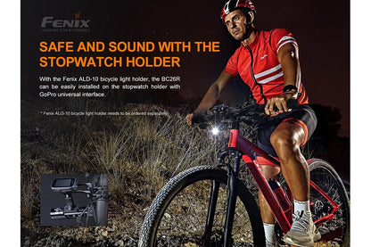 Fenix BC26R installed with the ALD-10 bicycle light holder on a stopwatch mount with GoPro universal interface, cyclist riding at night