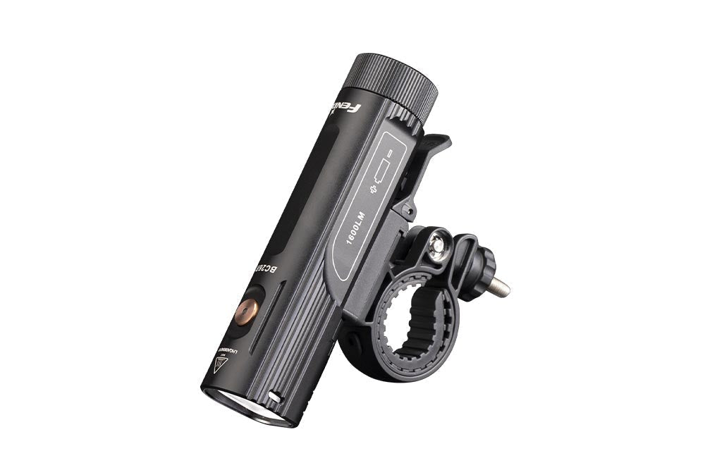 Fenix BC26R bike light side view showing USB-C port cover, 1600LM and BC26R markings, and quick-release handlebar mount clamp